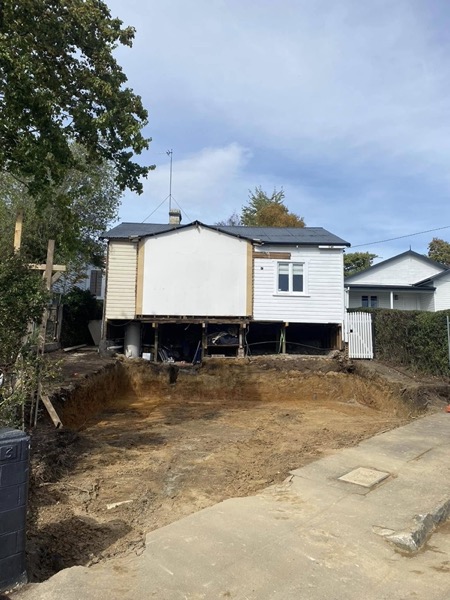 Excavation beneath a raised house on stumps