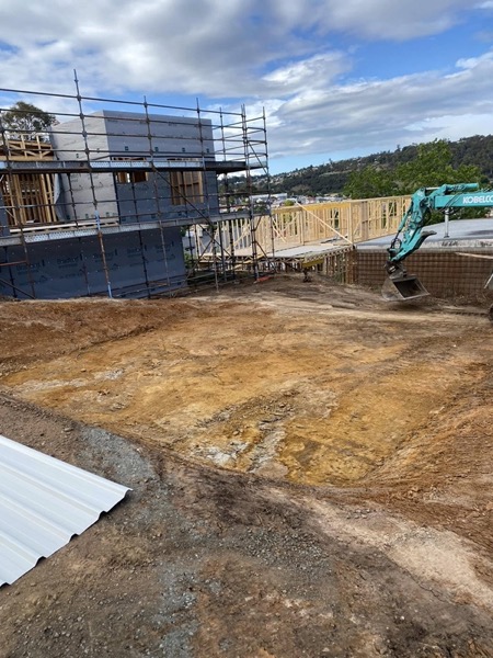 Excavation work near a truck at a building site