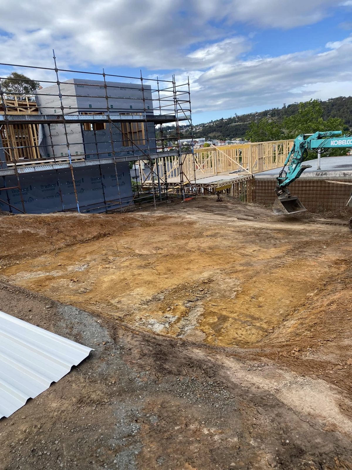 Excavation work near a truck at a building site